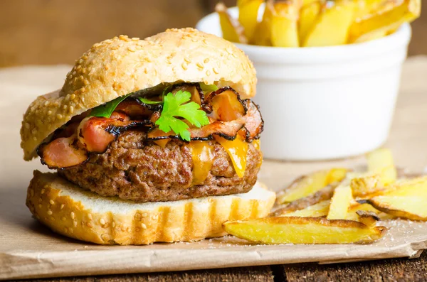 Beef burger with bacon, cheddar, homemade fries — Stock Photo, Image