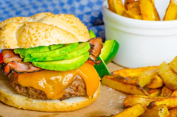 Homemade avocado burger with home spicy fries — Stock Photo, Image