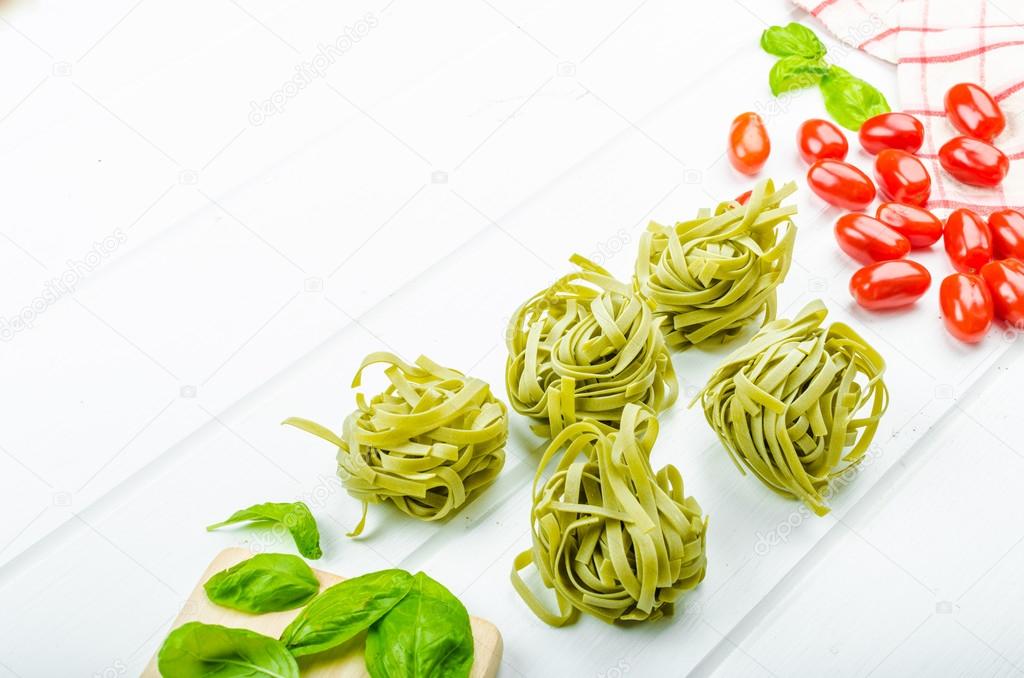 Pasta background - spinach tagliatelle