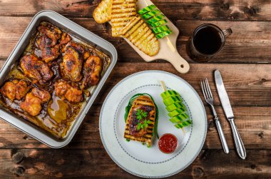 Sticky chicken with spicy sauce, toasted panini clipart
