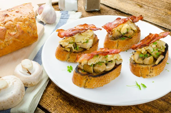 Rustic breakfast - bread toast, mushrooms, eggs — Stock Photo, Image