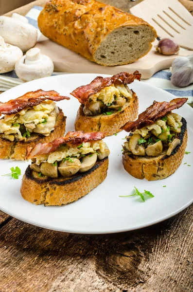 Rustic breakfast - bread toast, mushrooms, eggs — Stock Photo, Image