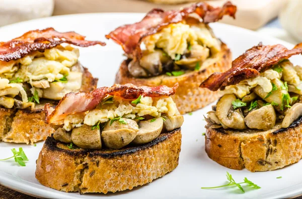 Rustic breakfast - bread toast, mushrooms, eggs — Stock Photo, Image