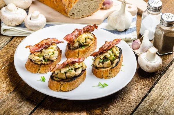 Rustic breakfast - bread toast, mushrooms, eggs — Stock Photo, Image