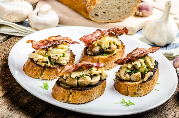 Rustic breakfast - bread toast, mushrooms, eggs — Stock Photo, Image