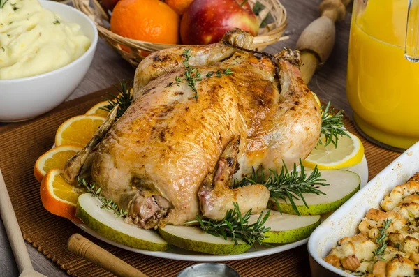 Feasting - stuffed roast chicken with herbs — Stock Photo, Image