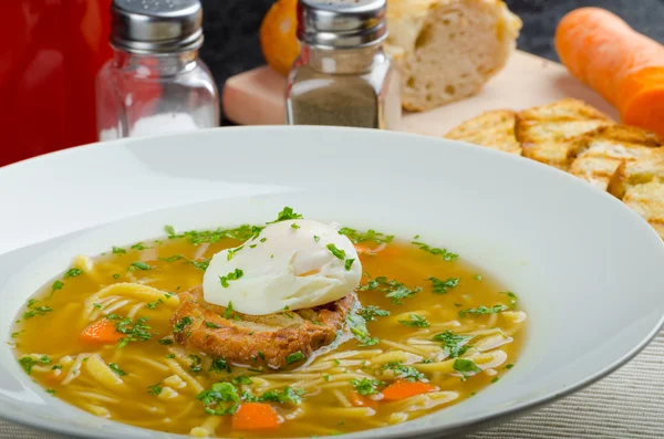 Beef broth with toast and egg benedict — Stock Photo, Image