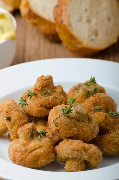 Breaded fried mushrooms with juice — Stock Image Breaded fried mushrooms with juice Royalty Free Stock Photos