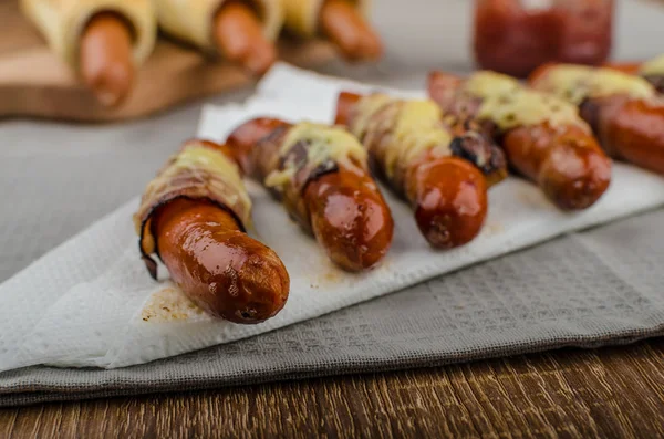 Fried sausage in a robe of bacon and cheese — Stock Photo, Image