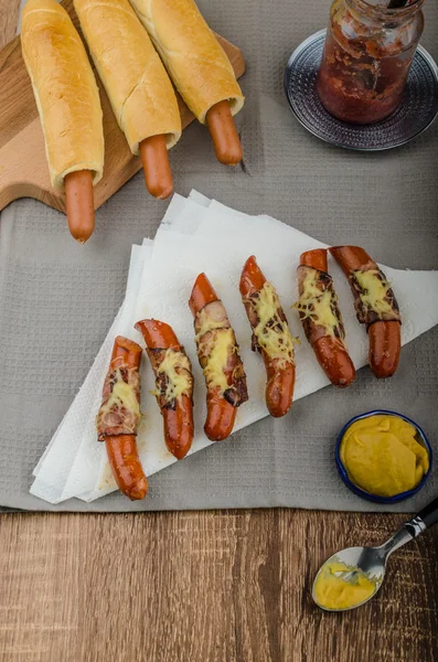 Fried sausage in a robe of bacon and cheese — Stock Photo, Image
