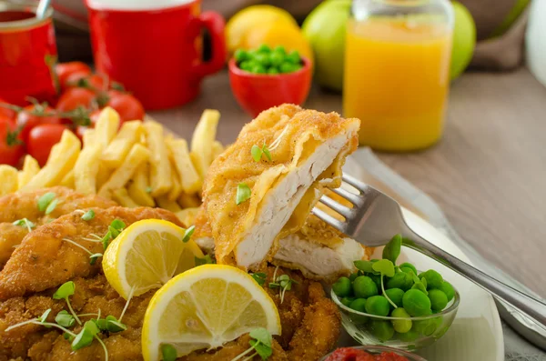 Schnitzel, french fries and microgreens salad — Stock Photo, Image