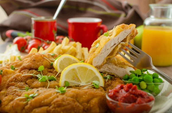 Schnitzel, french fries and microgreens salad — Stock Photo, Image