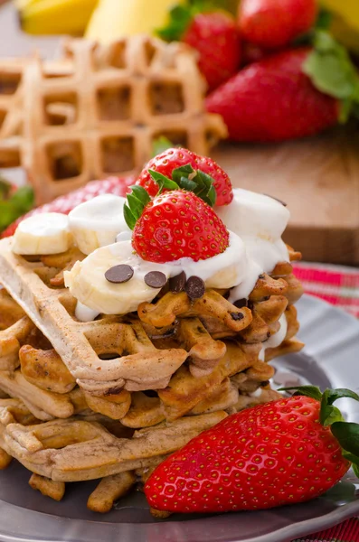 Belgian waffles with chocolate chips and fruits — Stock Photo, Image