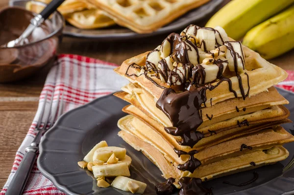 Waffles with bananas, nuts and chocolate — Stock Photo, Image