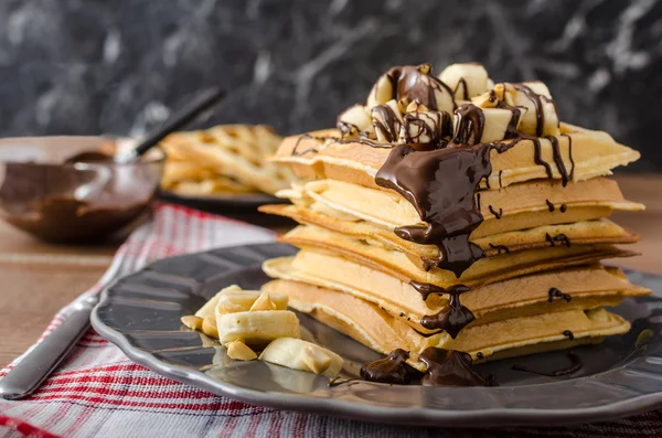 Waffles with bananas, nuts and chocolate — Stock Photo, Image