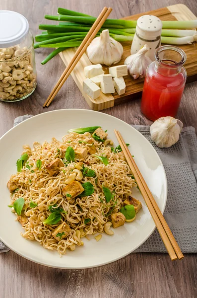 Chinese noodles with tofu and cashew nuts — Stock Photo, Image