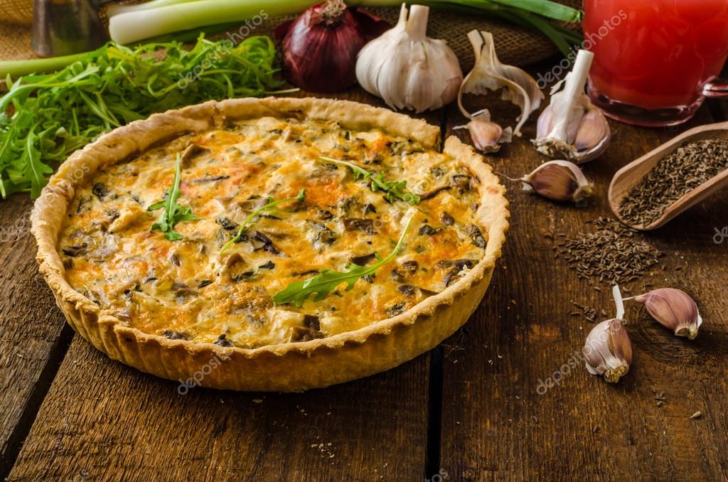 Cheese Quiche with chicken, arugula and mushrooms Stock Photo by