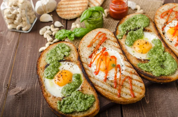 Vatiations of fried eggs inside bread — Stock Photo, Image