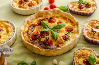 Quiche with cheese and cherry tomatoes clipart