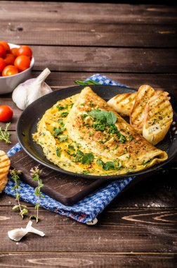 Herb omelette with chives and oregano sprinkled with Herb omelette with chili flakes