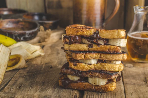 French toast filled banana and chocolate — стокове фото