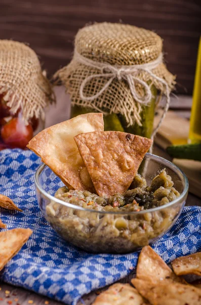 Homemade tortilla chips with garlic and eggplant dip — Stock Photo, Image