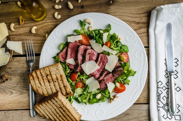 Rump steak with spicy herb butter — Stock Photo, Image