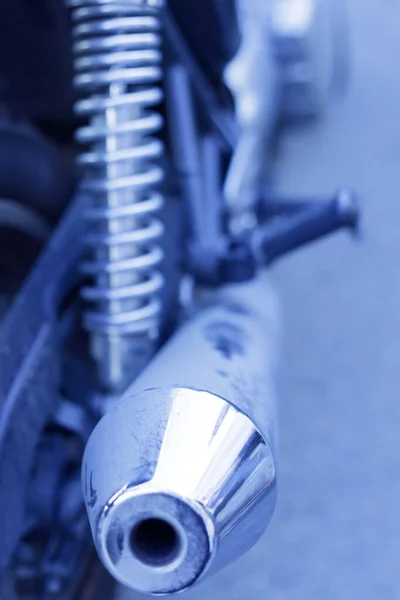 motorcycle exhaust pipe covered with a layer of dust