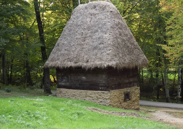 Old wooden rustic idyllic houses of Romanian folk culture. Old traditional Romanian house at the Astra museum in Sibiu, Romania.