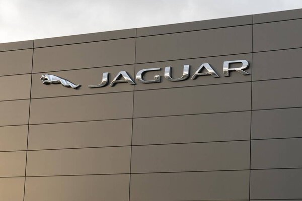 Burgos, SPAIN - December 06, 2020: Logo of the Jaguar Land Rover dealership in Burgos which is a British multinational car manufacturer based in Coventry in England