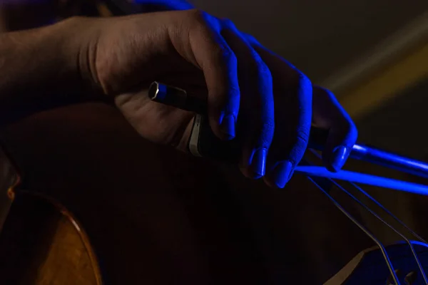Detail Bowed Hand Rubbing Strings Cello Artistic Blue Lights Selective — Foto Stock