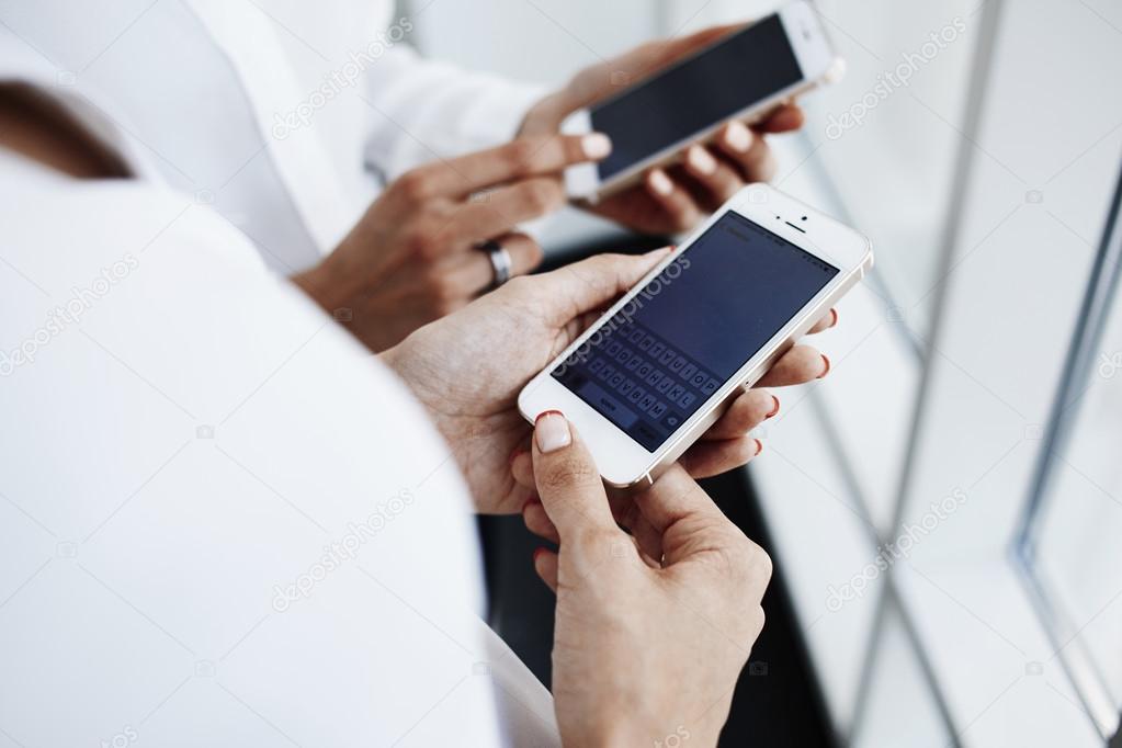 Woman`s hands holding cell telephone