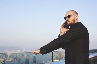 Young man having telephone conversation 