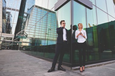 Young man boss with female partner