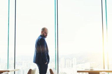 Young man entrepreneur in modern restaurant