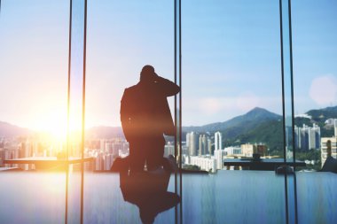 Silhouette of tired man entrepreneur