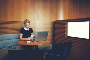 Young woman CEO reading e-mail