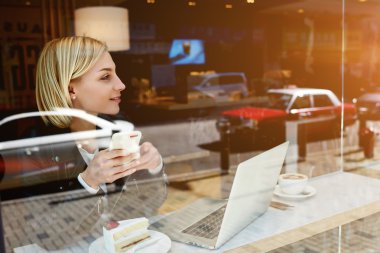 Young woman student with cell phone