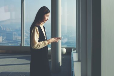Woman reading text message in network