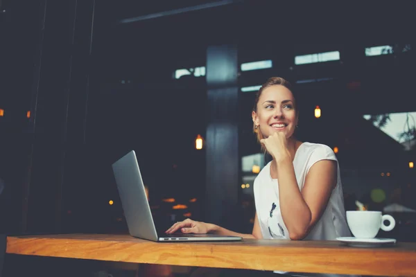 Charming happy woman student using laptop computer to prepare for the course work — Stock Photo, Image