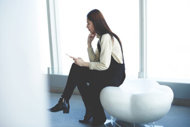 Woman searching information via cell phone