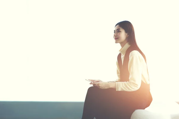 Woman professional holding smart phone — Stockfoto