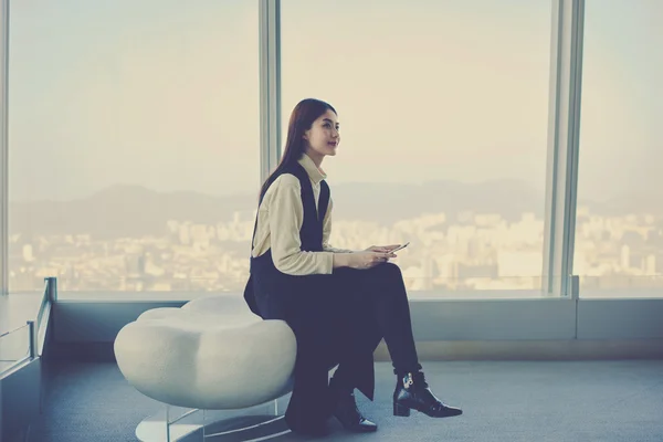 Young woman with mobile phone in hands — Stock Photo, Image