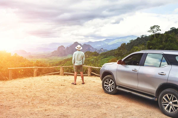 Man tourist admiring jungle landscape