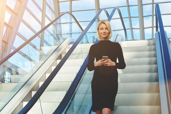 Young female CEO with mobile phone — Stock fotografie