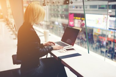 Woman booking online via net-book