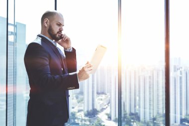 Young man CEO with digital tablet 