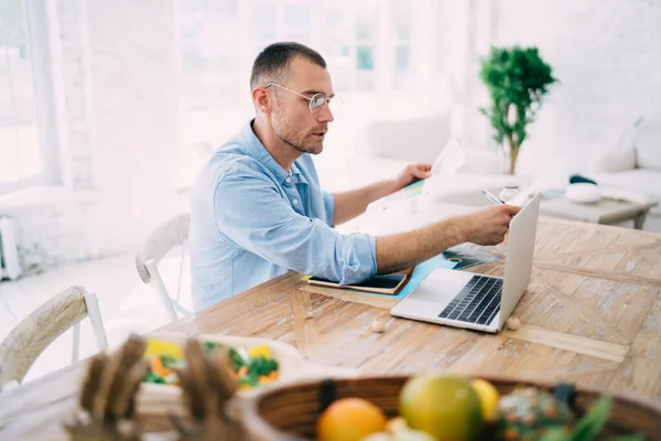 Side View Focused Male Freelancer Casual Clothes Glasses Sitting Wooden — Stock Photo, Image