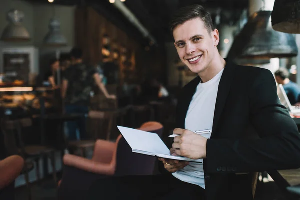 Cheerful Male Freelancer Casual Wear Working Remotely Cafe Writing Plans — Stock Photo, Image