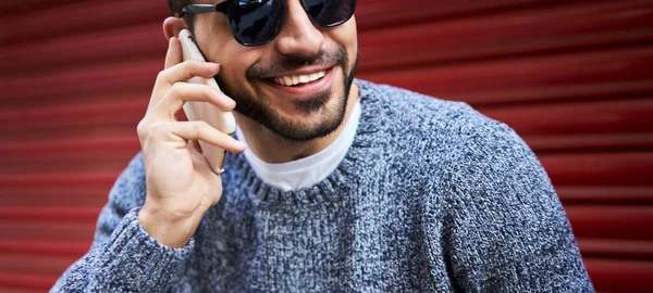 Positive Bearded Male Warm Sweater Sunglasses Having Phone Conversation While — Stock Photo, Image